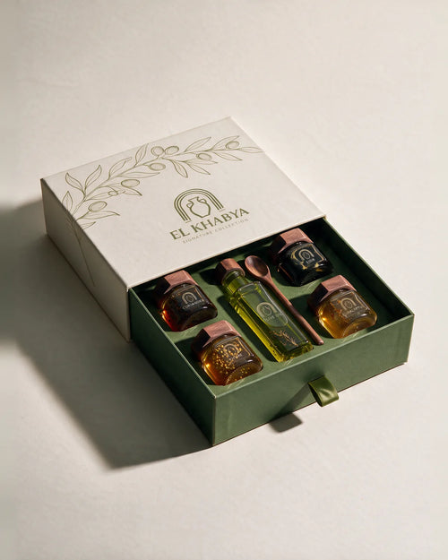 Signature Collection — open El Khabya gift box with infused honeys and spiced olive oil